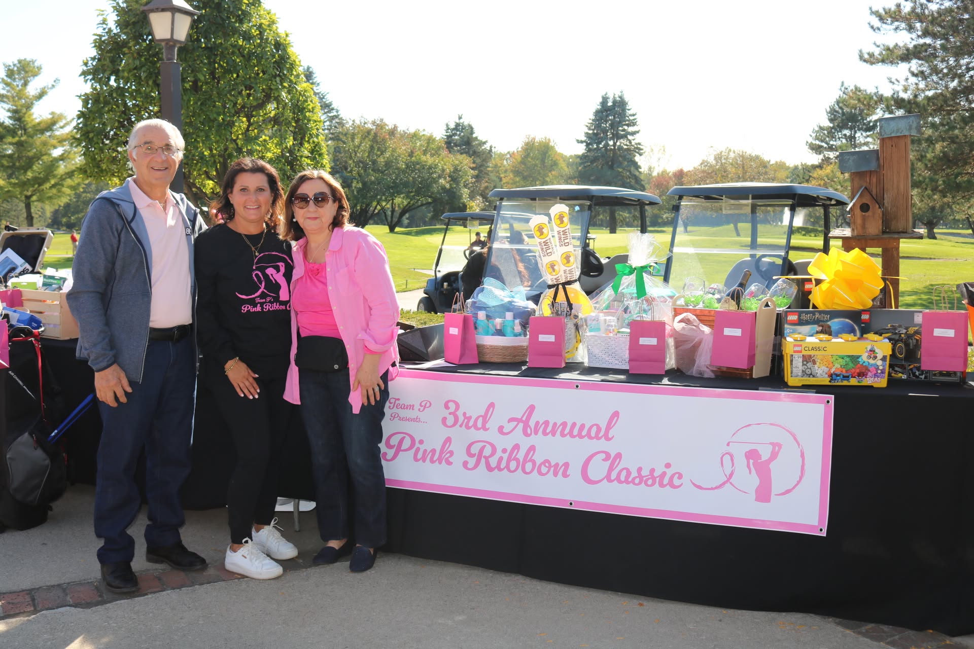 Team P family at the raffle table